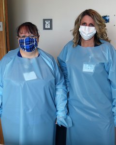 Abby and Marissa modeling a gown